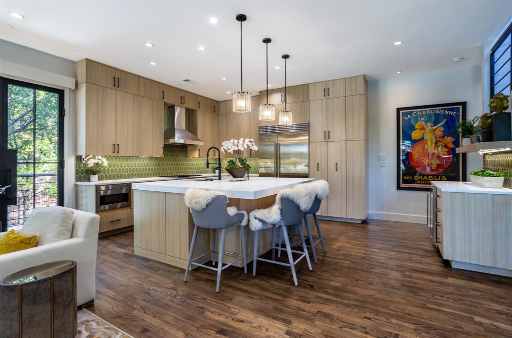 2630 Welborn Street Dallas, TX 75219 - Photo 18 of 40 a dining room with furniture a window and appliances