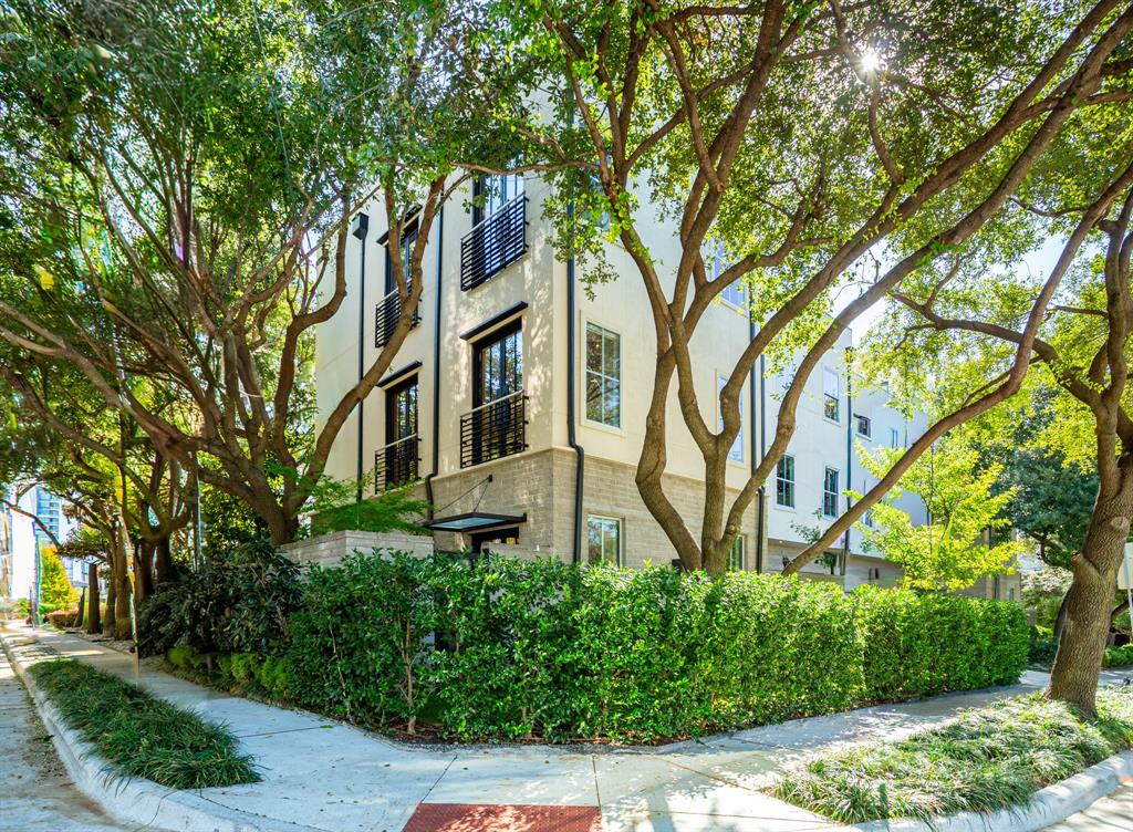2630 Welborn Street Dallas, TX 75219 - Photo 2 of 40 a front view of a house with garden