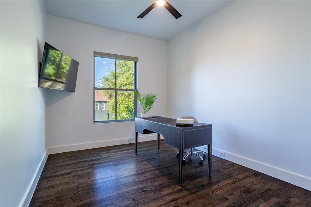 2630 Welborn Street Dallas, TX 75219 - Photo 24 of 40 a view of a workspace with furniture and a window