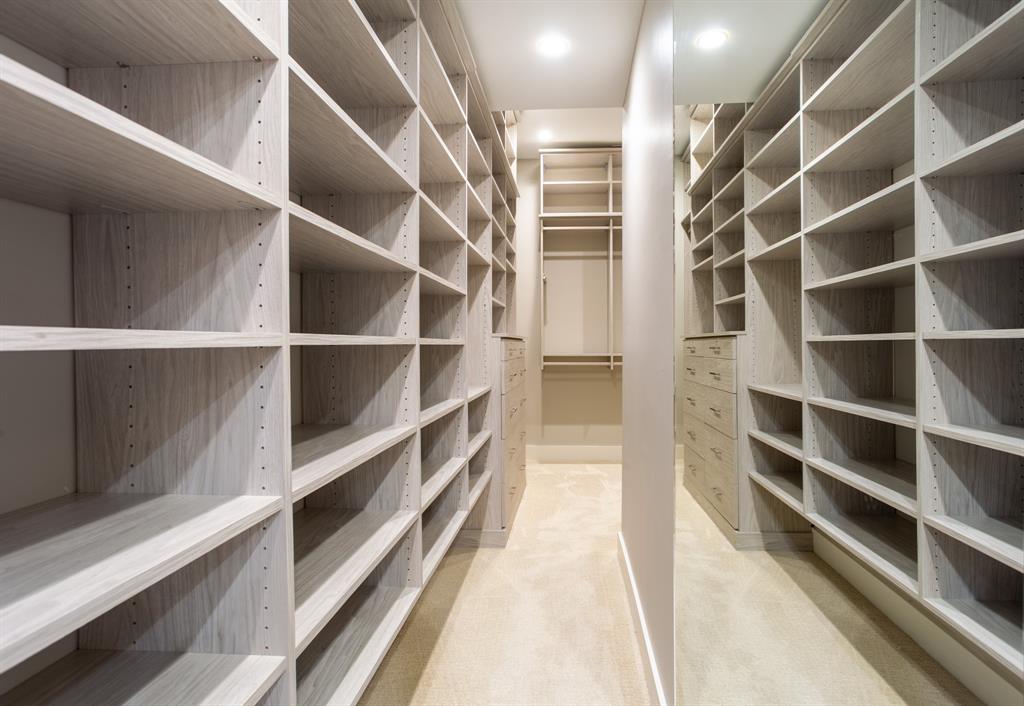 2630 Welborn Street Dallas, TX 75219 - Photo 29 of 40 a view of walk in closet with empty racks