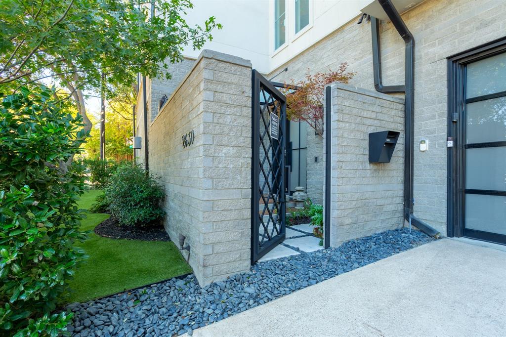 2630 Welborn Street Dallas, TX 75219 - Photo 3 of 40 a view of a brick house with a small entryway
