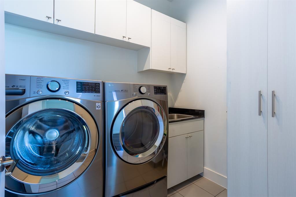 2630 Welborn Street Dallas, TX 75219 - Photo 31 of 40 a utility room with dryer and washer