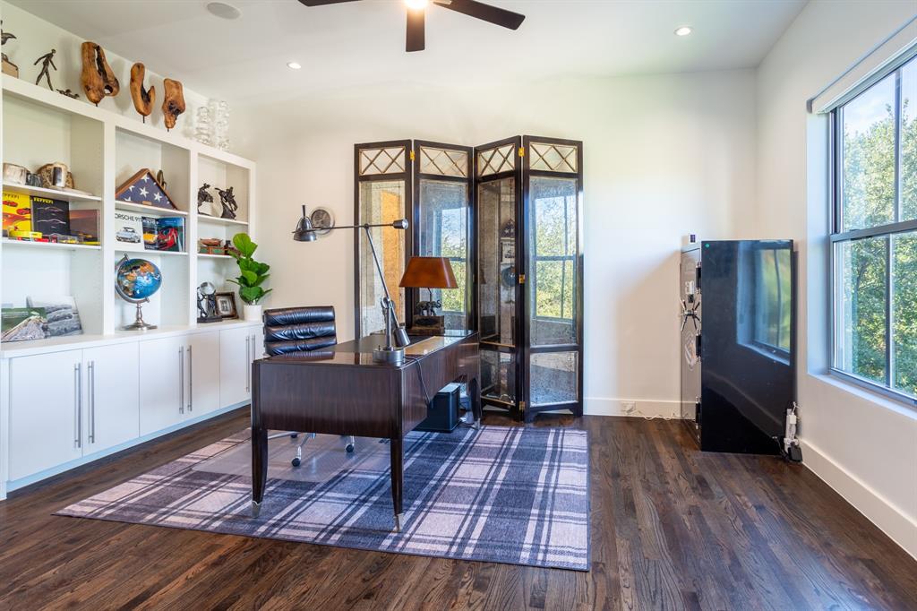2630 Welborn Street Dallas, TX 75219 - Photo 32 of 40 a living room with furniture and a wooden floor