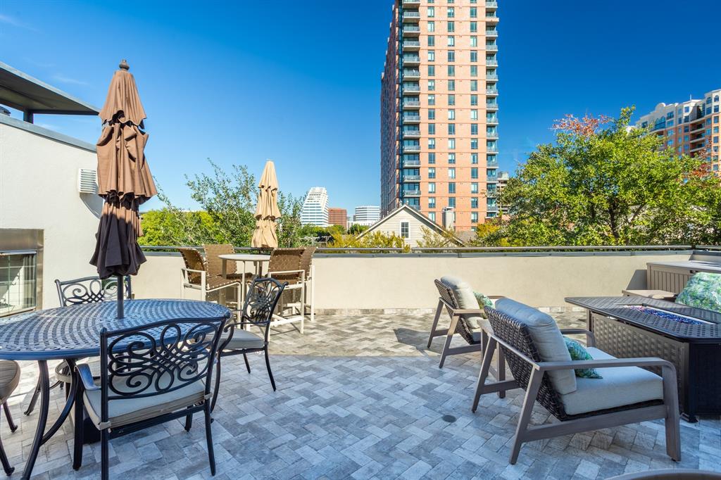 2630 Welborn Street Dallas, TX 75219 - Photo 38 of 40 a view of a chairs and table in patio