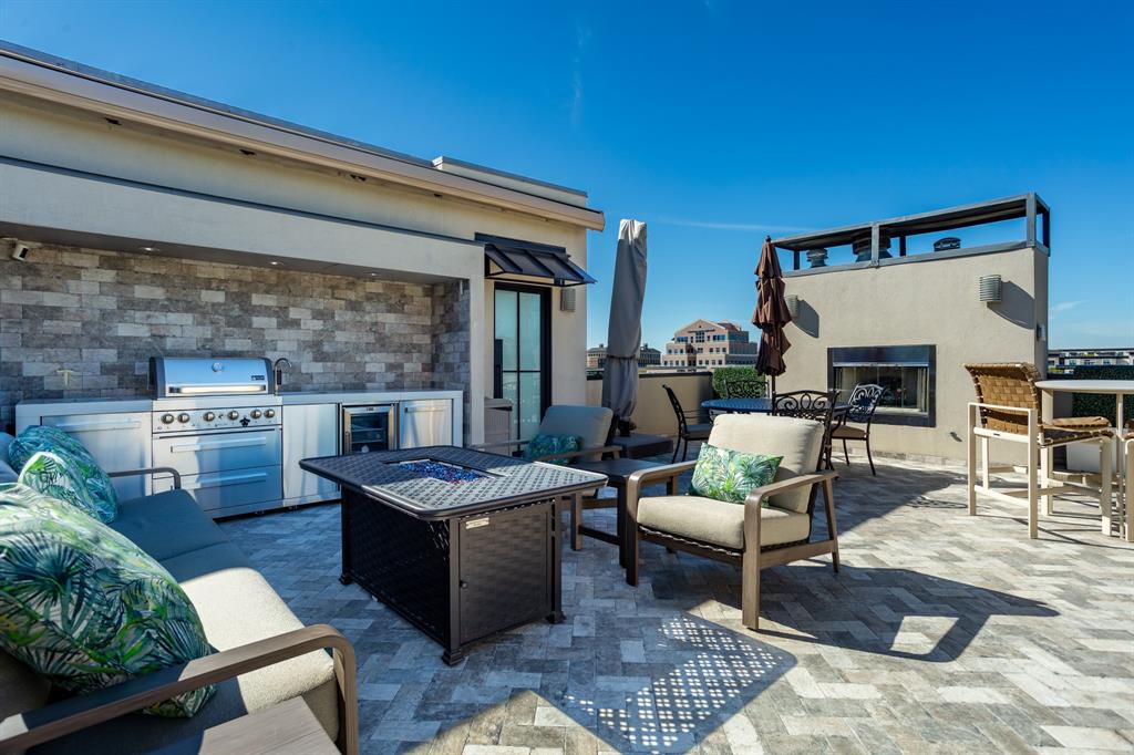 2630 Welborn Street Dallas, TX 75219 - Photo 39 of 40 a living room with furniture and a table