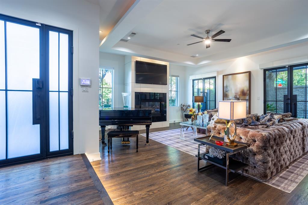 2630 Welborn Street Dallas, TX 75219 - Photo 5 of 40 a living room with furniture and a fireplace