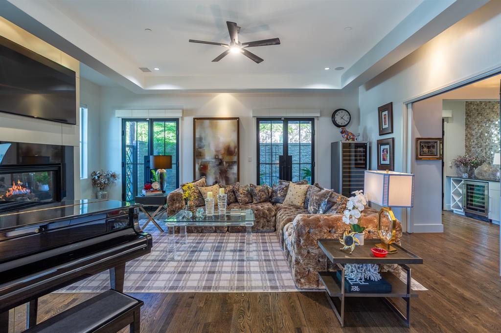 2630 Welborn Street Dallas, TX 75219 - Photo 7 of 40 a living room with furniture fireplace and flat screen tv