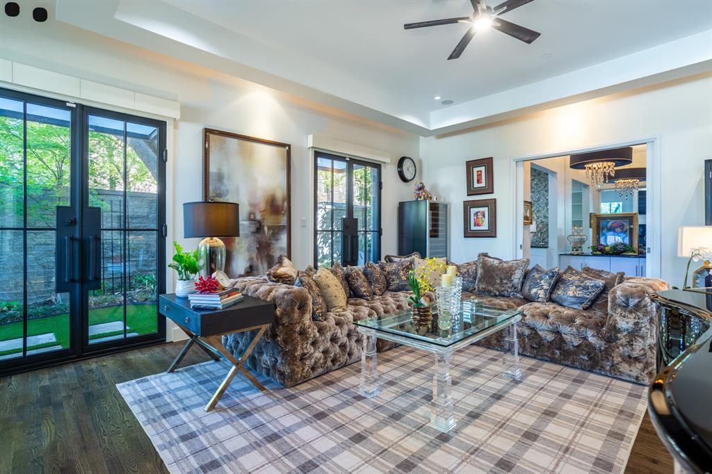 2630 Welborn Street Dallas, TX 75219 - Photo 8 of 40 a living room with furniture and a floor to ceiling window