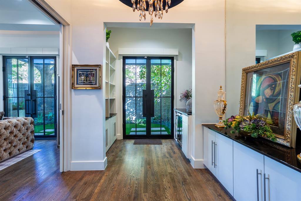 2630 Welborn Street Dallas, TX 75219 - Photo 9 of 40 a view of a hallway and wooden floor and dining room