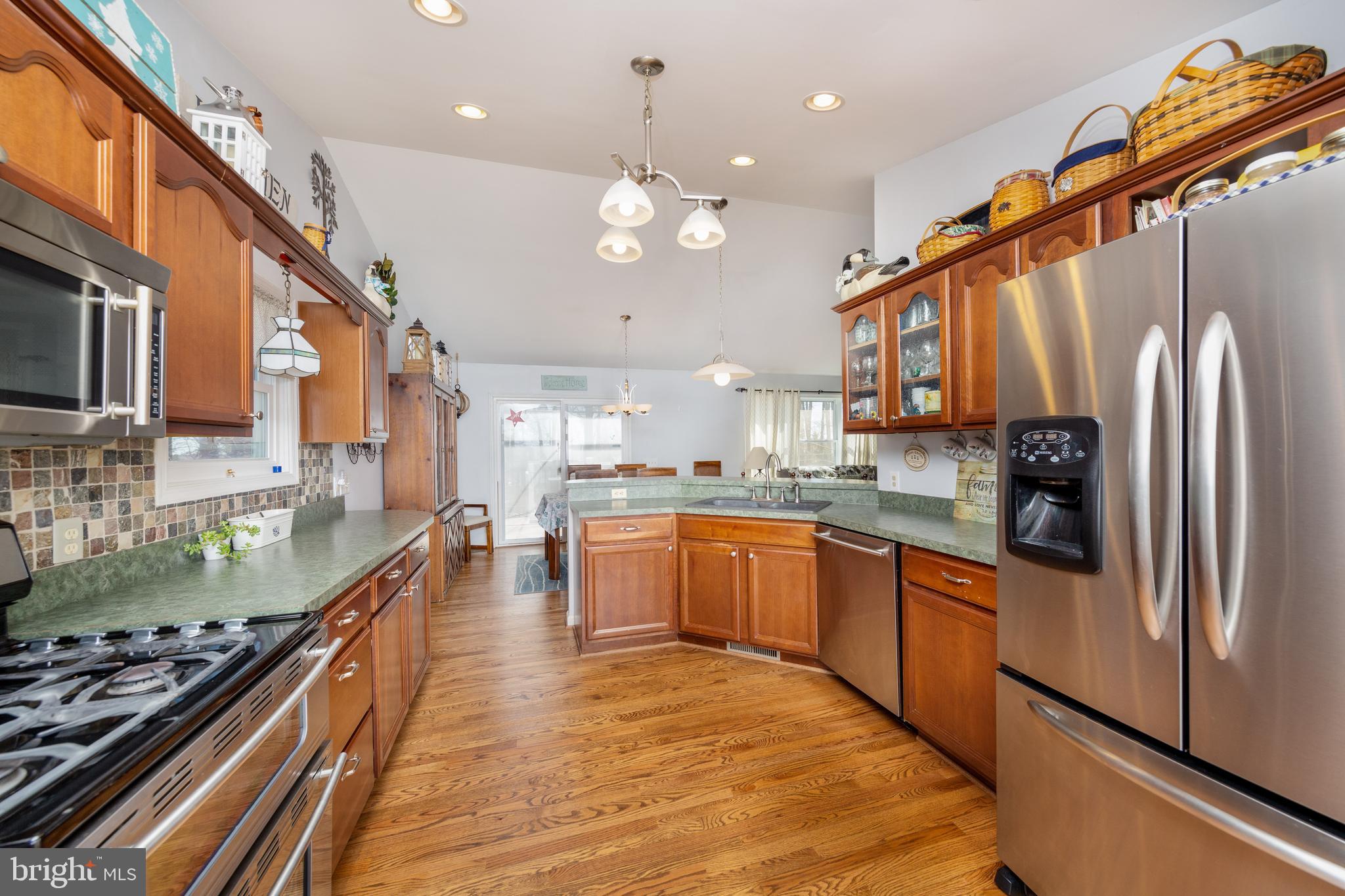 198 Clubhouse Road Delta, PA 17314 - Photo 21 of 37 KITCHEN WITH NEW HARDWOOD & STAINLESS APPLIANCES
