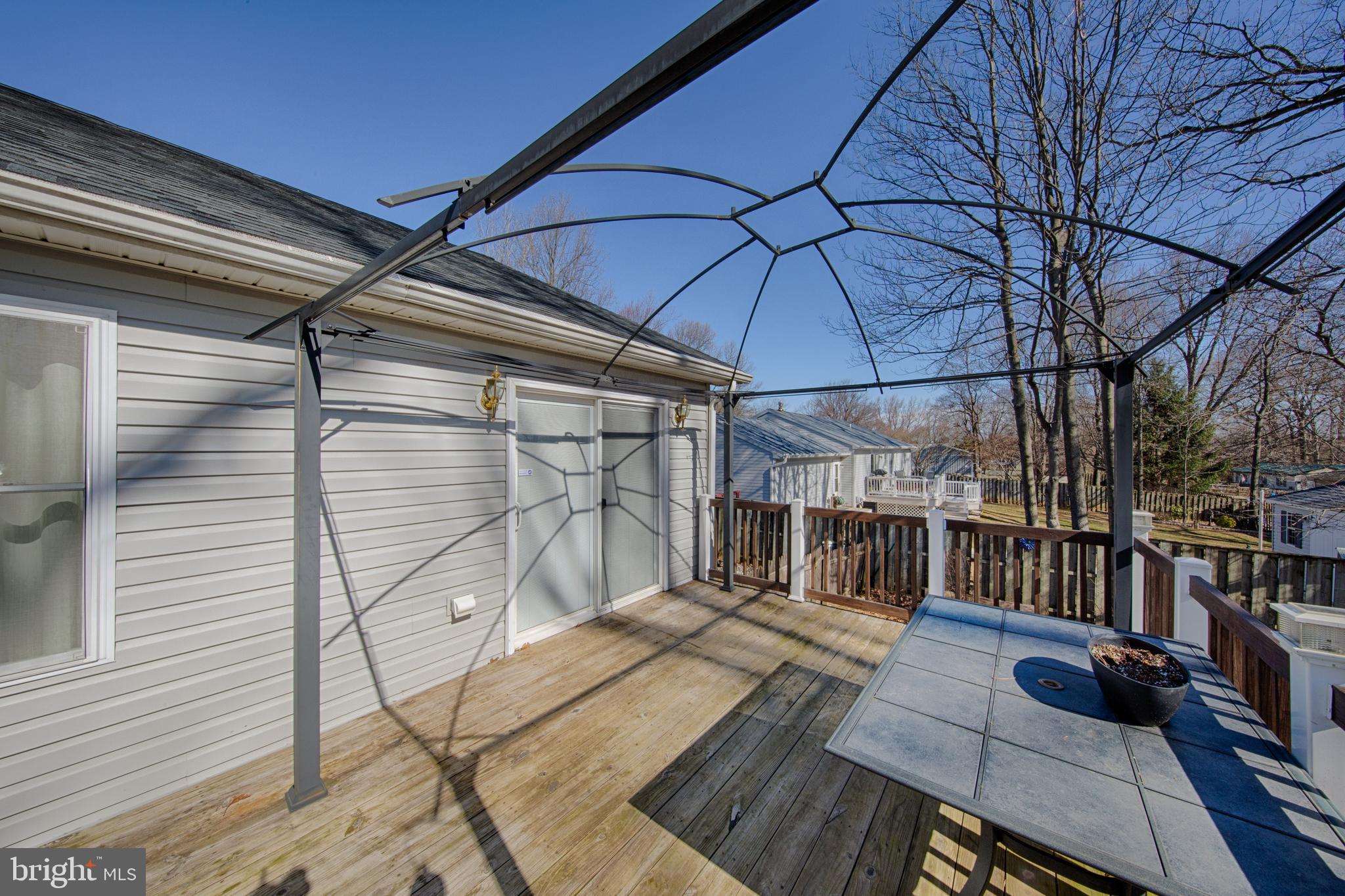 198 Clubhouse Road Delta, PA 17314 - Photo 8 of 37 NEW SLIDER LEADS TO DECK WITH AWNING