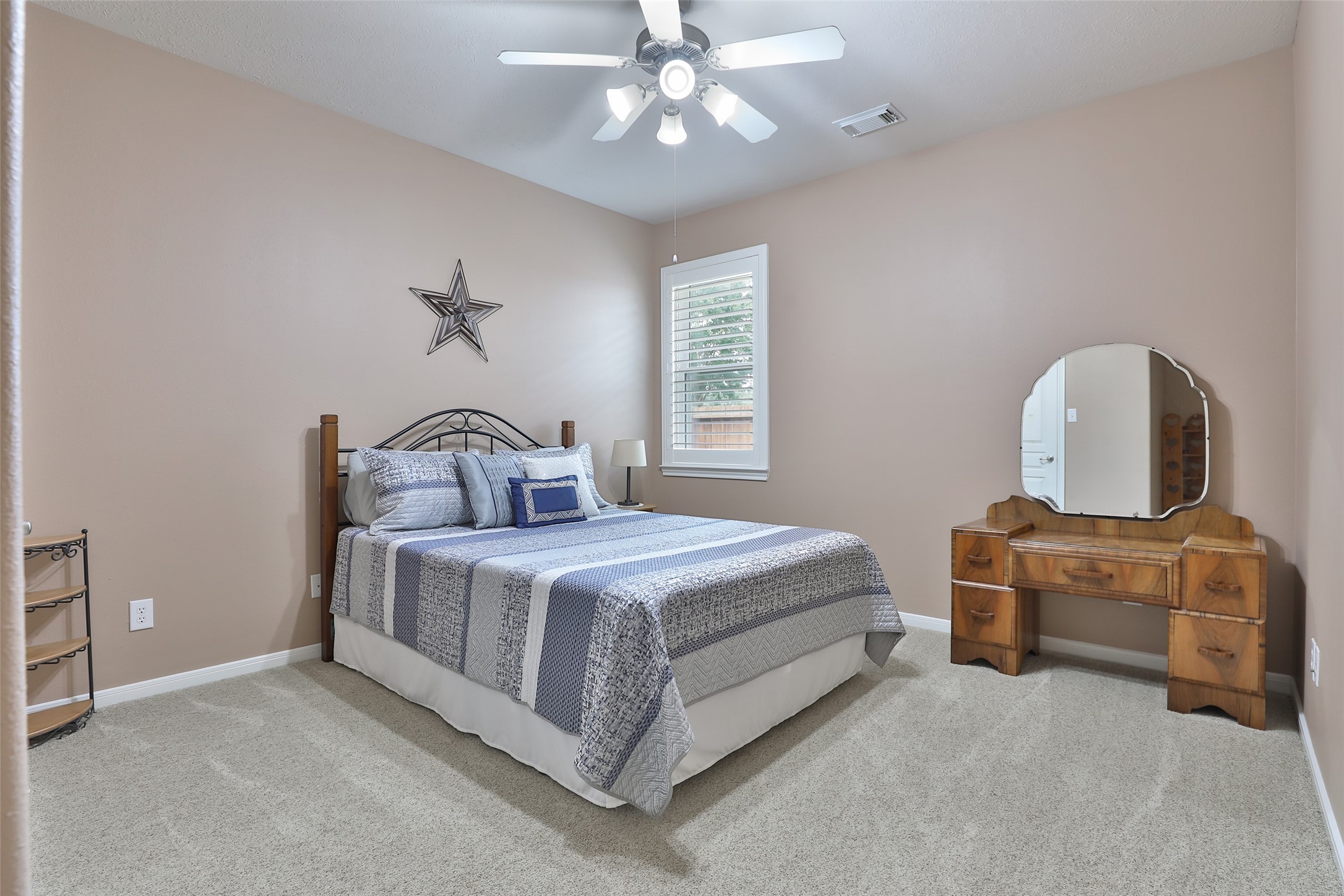 20519 Windrose Bend Drive Spring, TX 77379 - Photo 24 of 37 Secondary bedrooms two and three are situated at the rear of the home and feature access to a dedicated full bathroom.