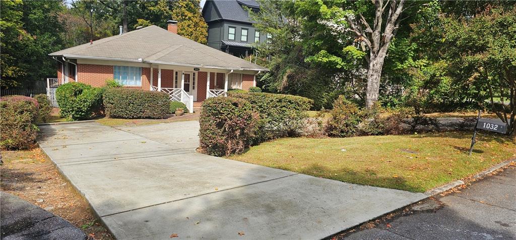 front view of house next to a yard