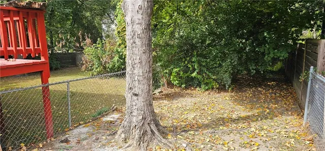 a view of a backyard of the house