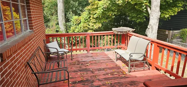 a view of a two chairs in the balcony