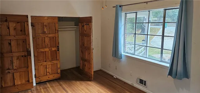 a view of walk in closet with empty room