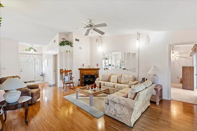 an empty room with closet and fan