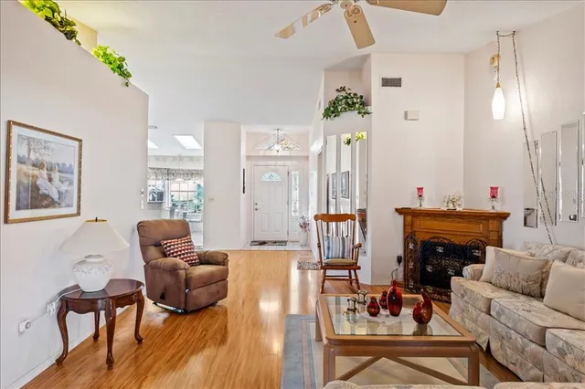 a living room with furniture and a fireplace