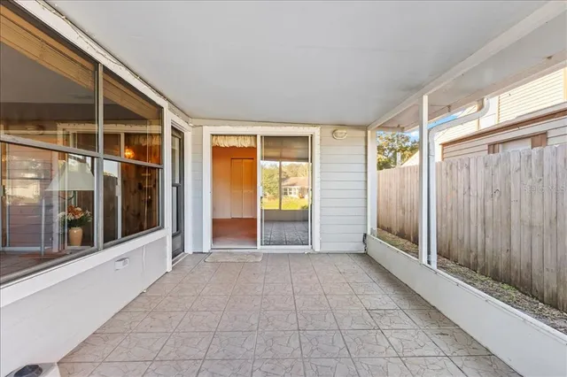 an aerial view of residential houses with outdoor space and swimming pool