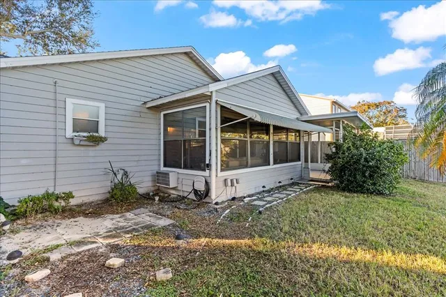 an aerial view of a house with swimming pool and outdoor space