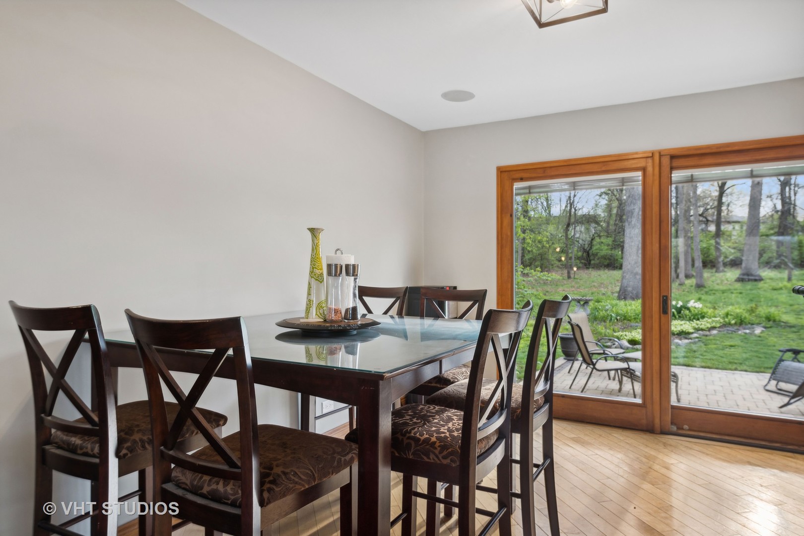 8521 Una Avenue Naperville, IL 60565 - Photo 14 of 41 a view of a dining room with furniture and wooden floor