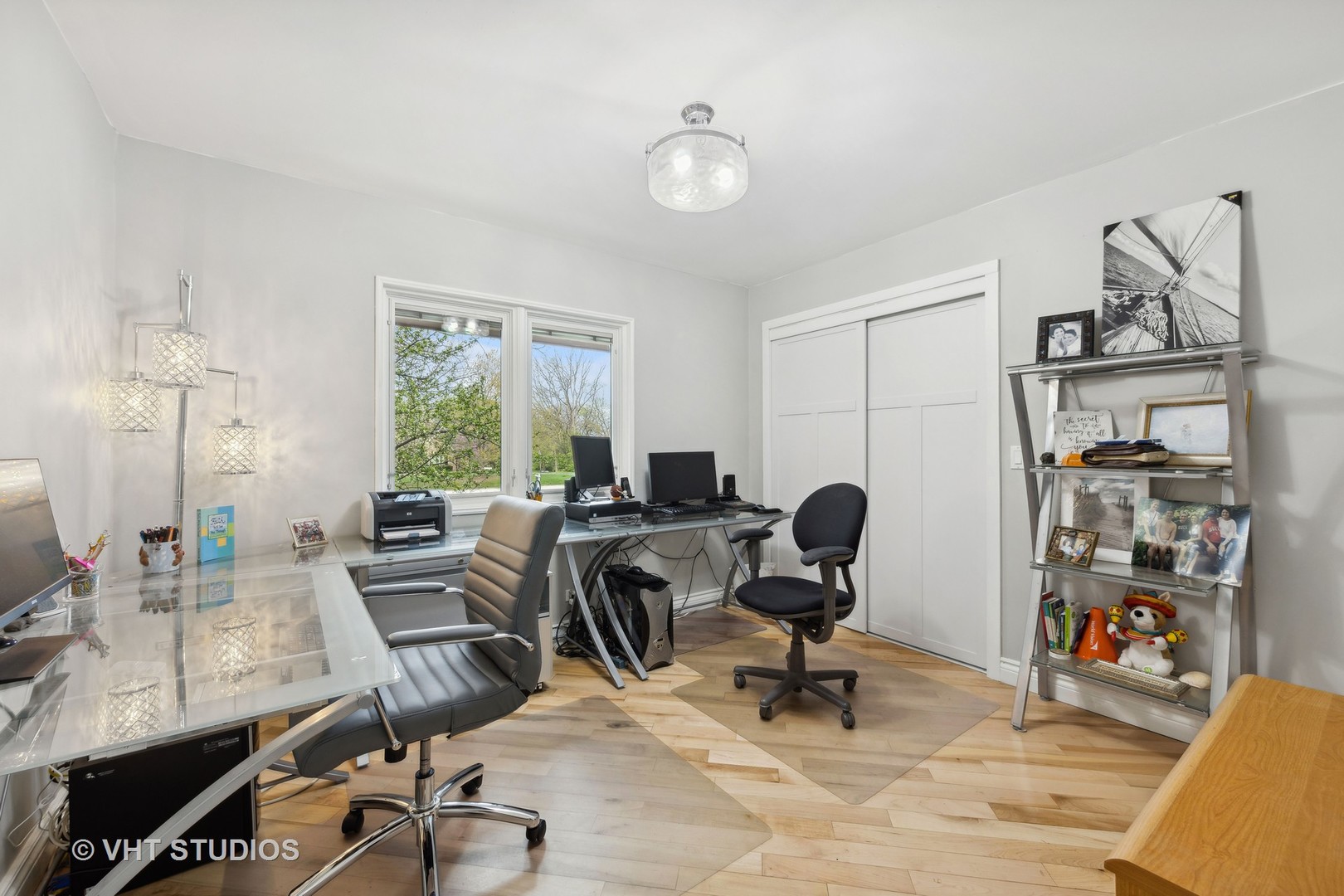 8521 Una Avenue Naperville, IL 60565 - Photo 18 of 41 a view of a workspace with furniture and a window