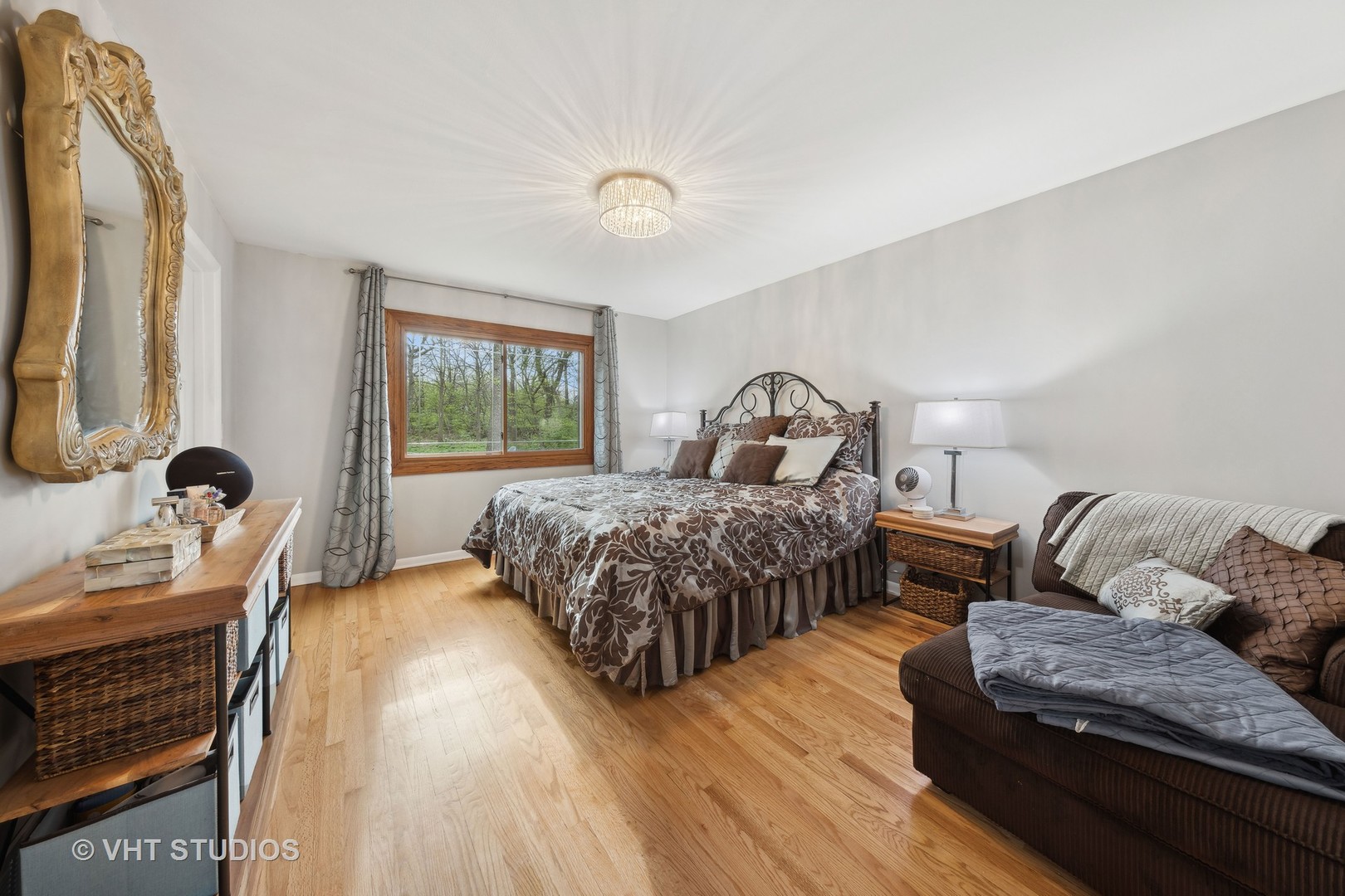 8521 Una Avenue Naperville, IL 60565 - Photo 19 of 41 a bedroom with a bed couch and a window