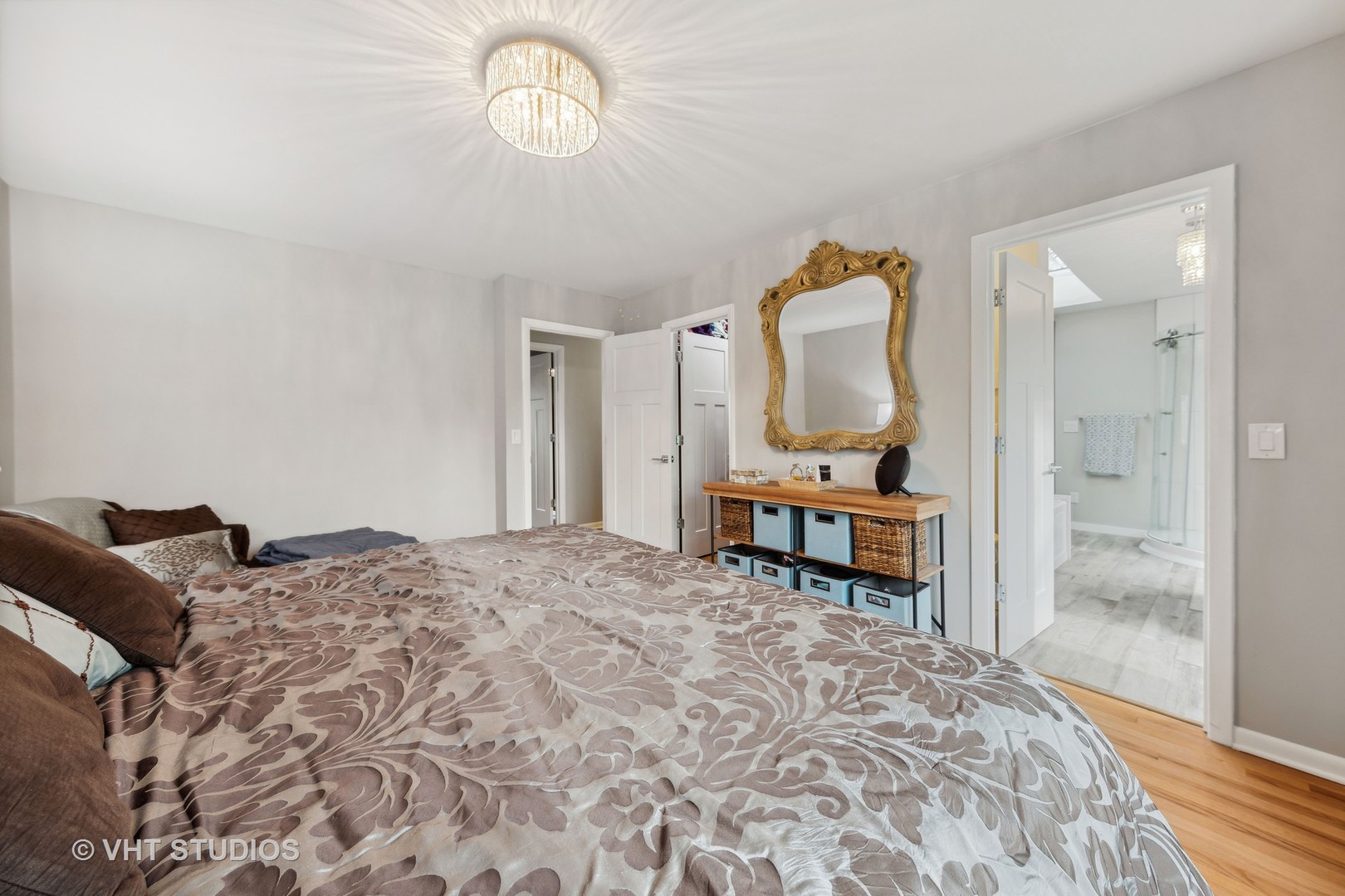 8521 Una Avenue Naperville, IL 60565 - Photo 20 of 41 a bedroom with a bed next to a window with a chandelier