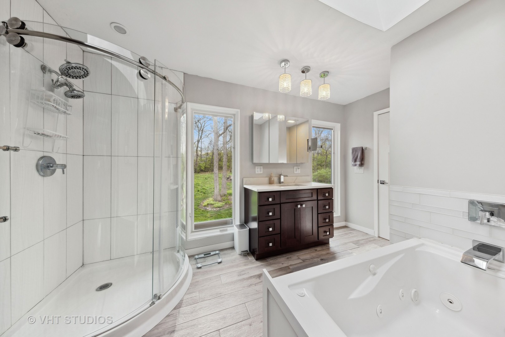8521 Una Avenue Naperville, IL 60565 - Photo 21 of 41 a bathroom with a tub sink shower and mirror