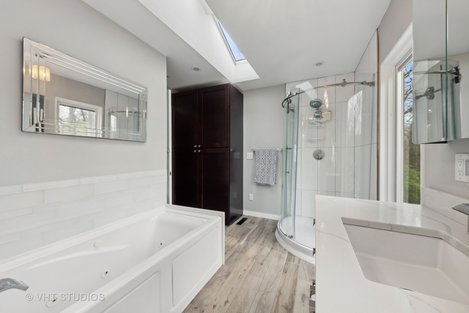 8521 Una Avenue Naperville, IL 60565 - Photo 22 of 41 a bathroom with a bathtub and a shower