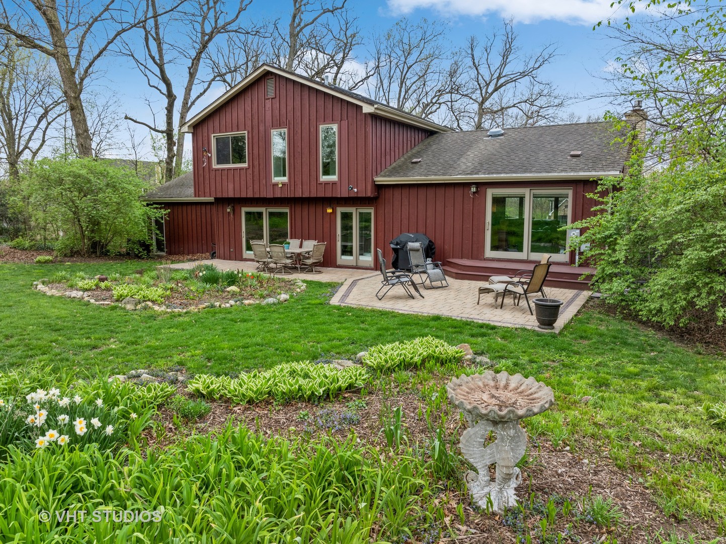 8521 Una Avenue Naperville, IL 60565 - Photo 29 of 41 a front view of a house with patio and garden