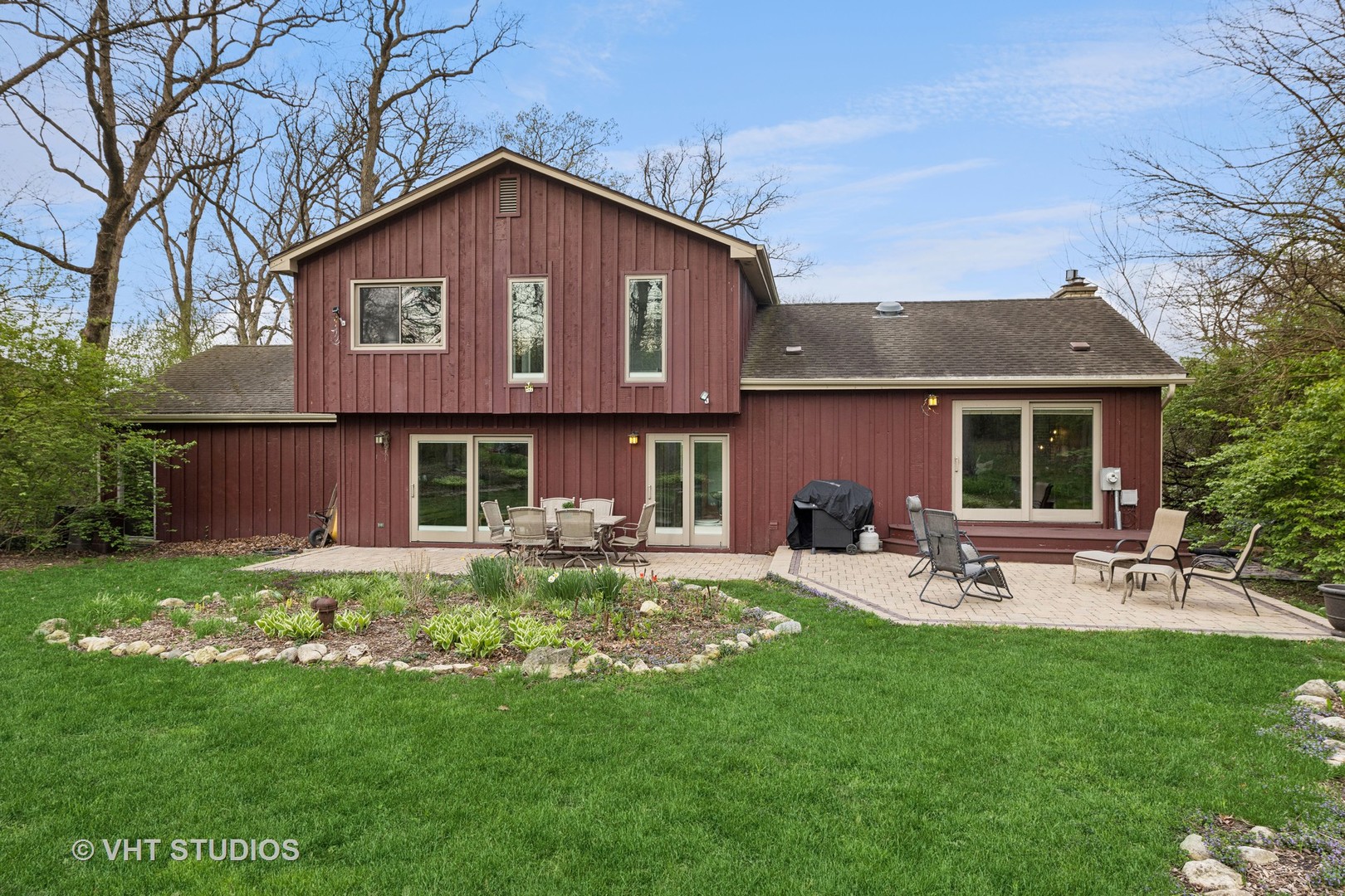 8521 Una Avenue Naperville, IL 60565 - Photo 6 of 41 a front view of a house with a garden and patio
