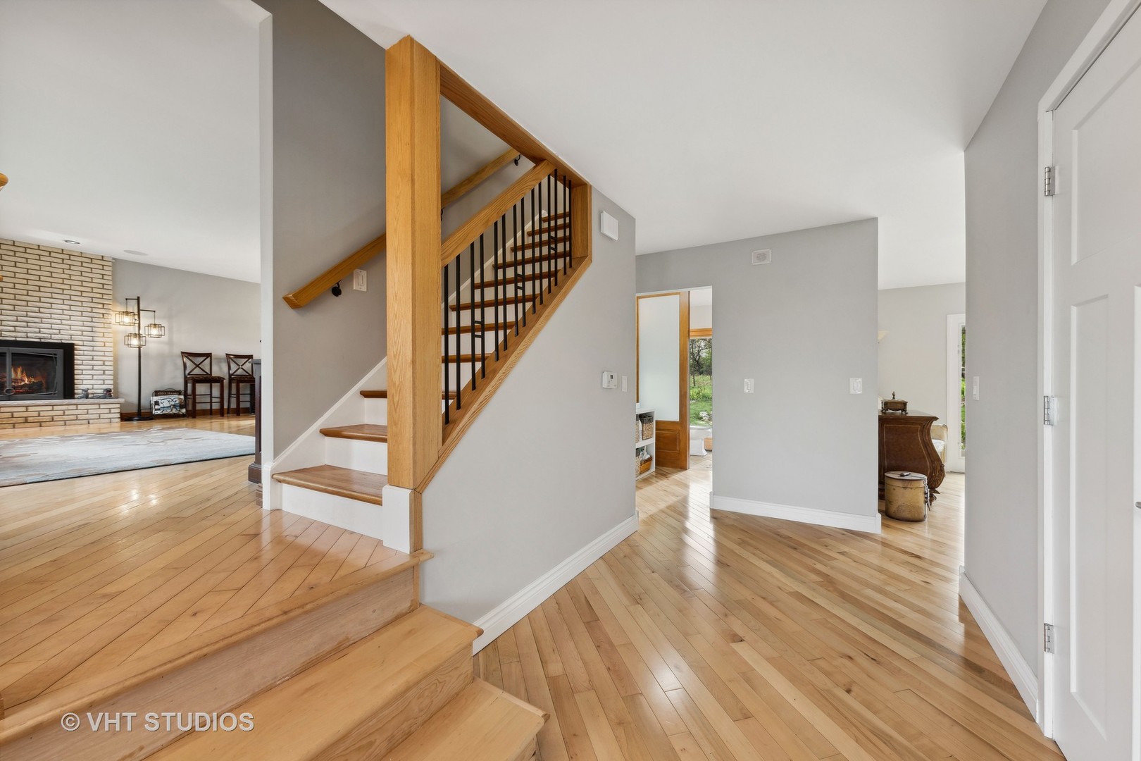 8521 Una Avenue Naperville, IL 60565 - Photo 8 of 41 a view of entryway and hall with wooden floor