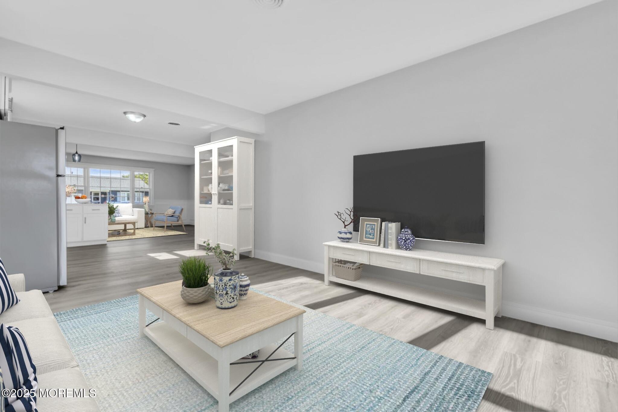 29 Carlisle Road Toms River, NJ 08757 - Photo 14 of 23 a living room with furniture and a flat screen tv