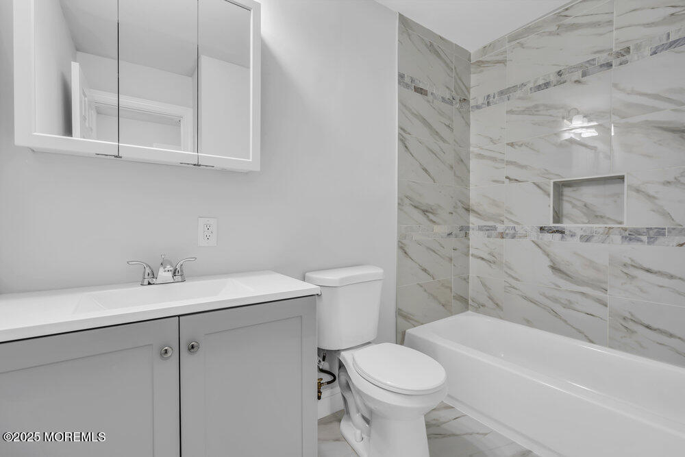 29 Carlisle Road Toms River, NJ 08757 - Photo 16 of 23 a bathroom with a sink toilet and shower