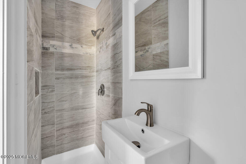 29 Carlisle Road Toms River, NJ 08757 - Photo 19 of 23 a bathroom with a sink and a shower