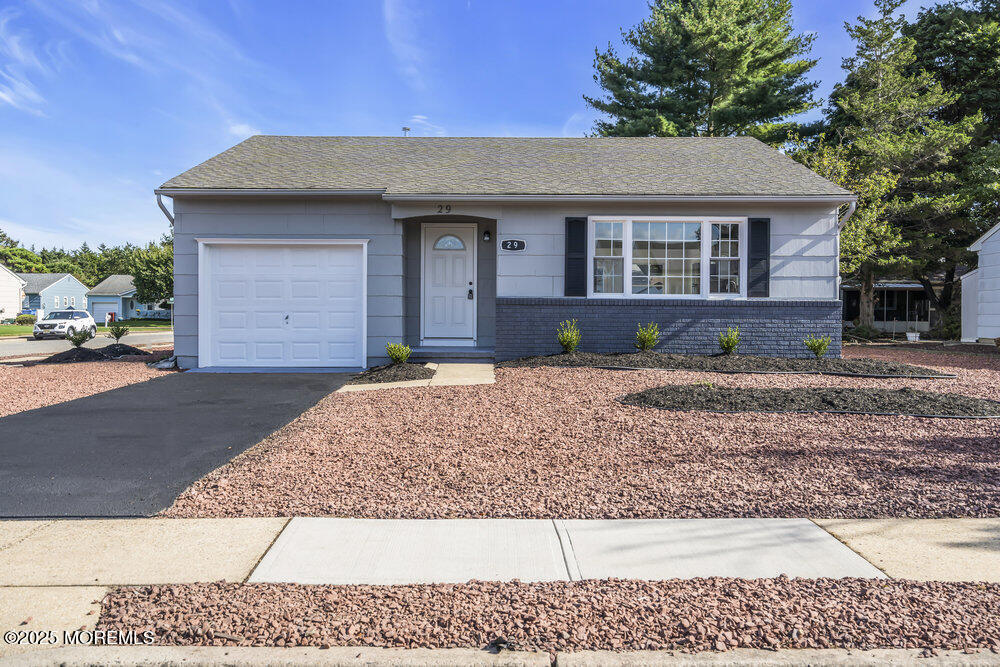 29 Carlisle Road Toms River, NJ 08757 - Photo 2 of 23 a front view of a house with a yard
