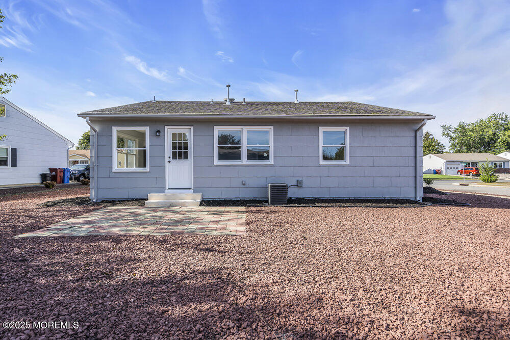 29 Carlisle Road Toms River, NJ 08757 - Photo 10 of 23 a brick house with a yard