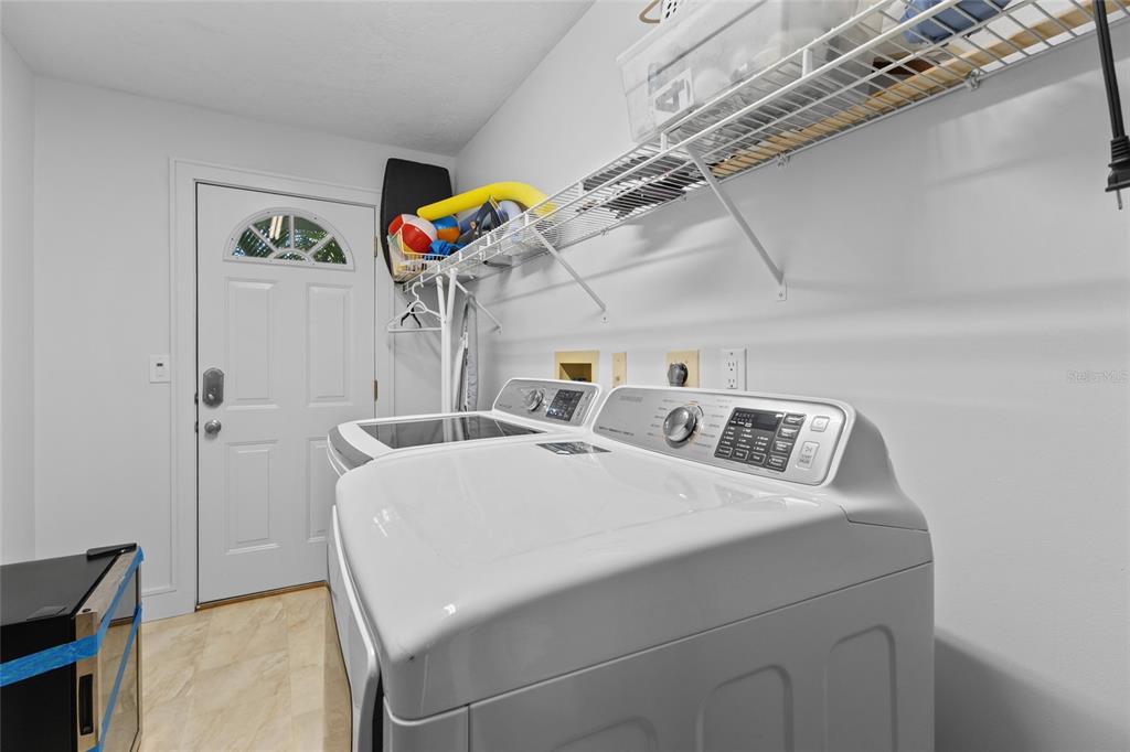 315 Spring Avenue Anna Maria, FL 34216 - Photo 37 of 63 a utility room with dryer and washer