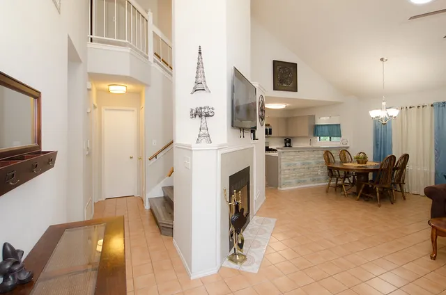a view of a livingroom with furniture and a fireplace