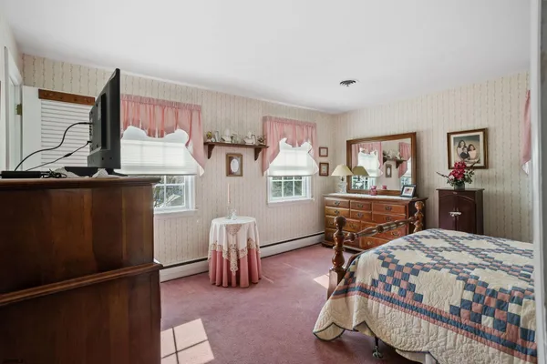 a bedroom with a bed and a cabinets