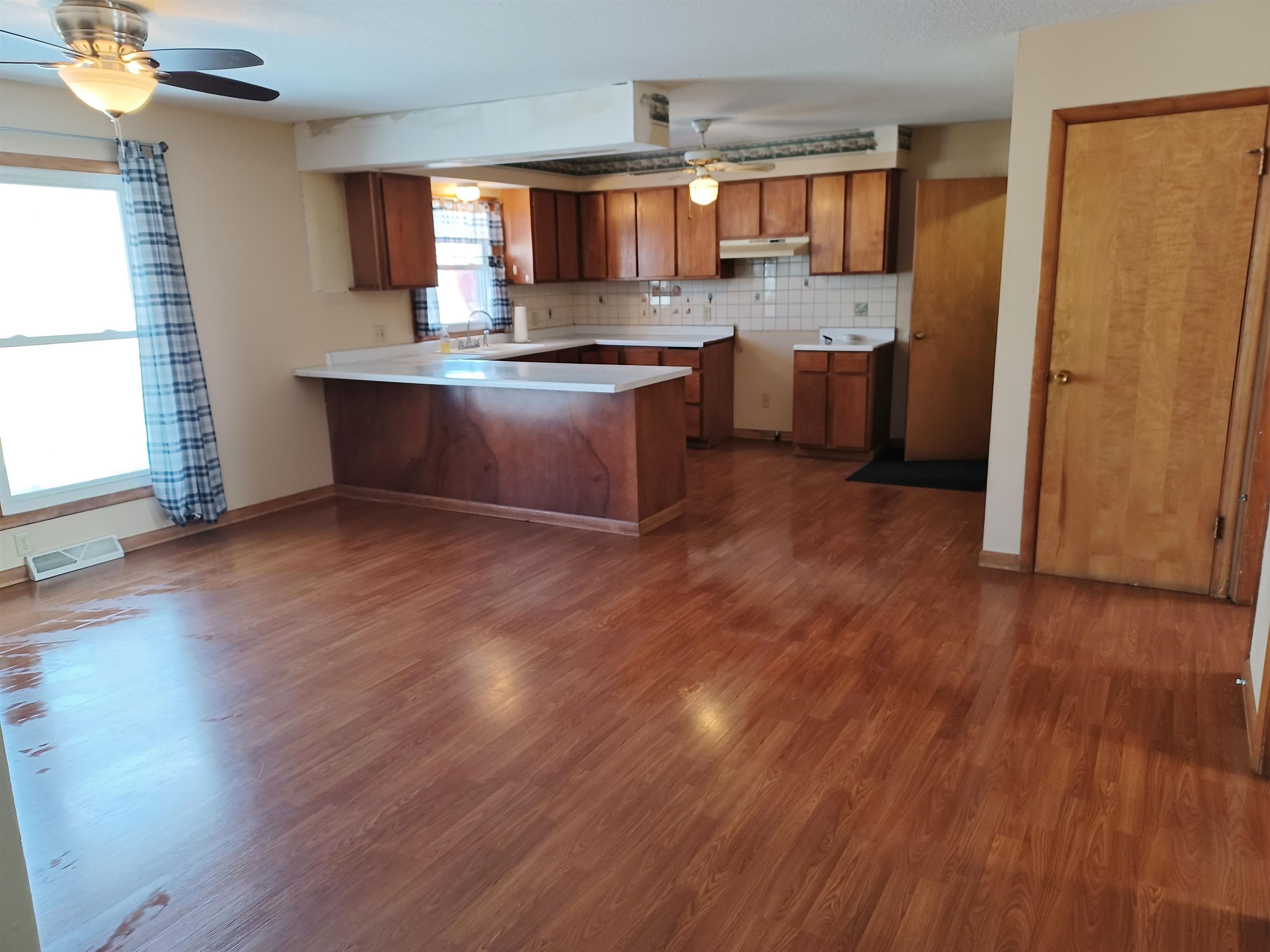 5162 Simpson Road Rockford, IL 61102 - Photo 5 of 14 a kitchen with stainless steel appliances granite countertop a sink stove and wooden floor