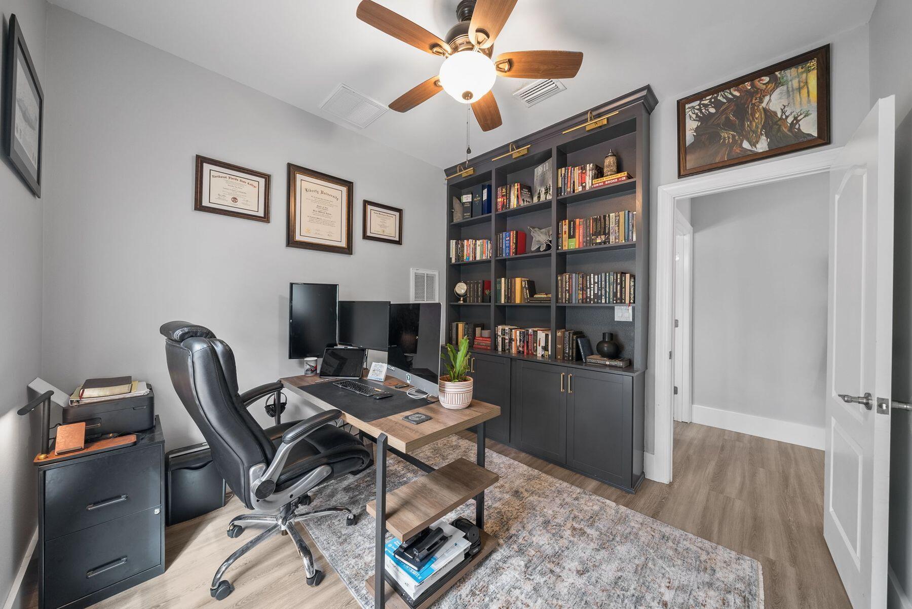 297 Cox Road Santa Rosa Beach, FL 32459 - Photo 15 of 41 a workspace with a bookshelf