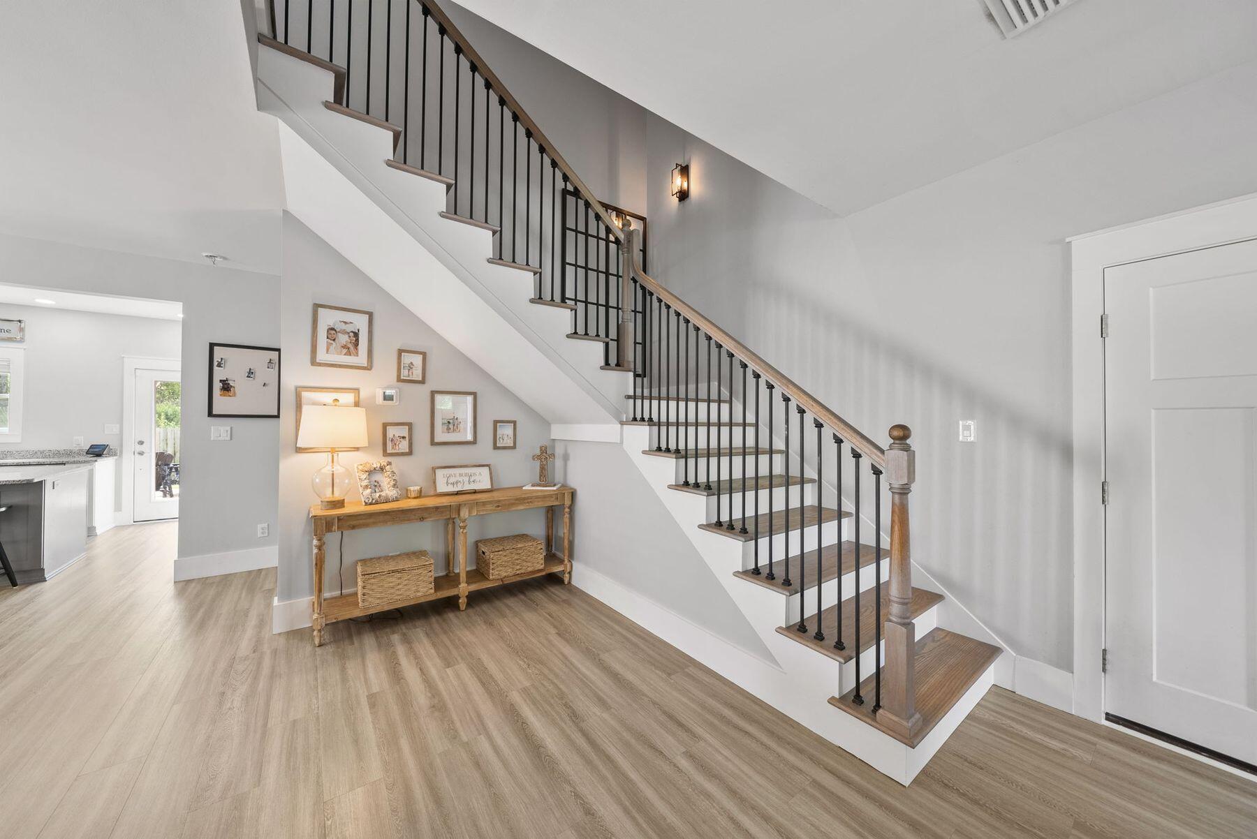 297 Cox Road Santa Rosa Beach, FL 32459 - Photo 17 of 41 a view of entryway and hall with wooden floor