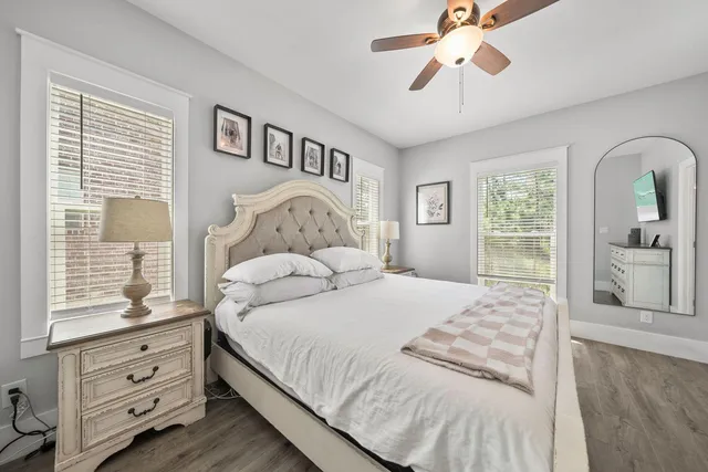 a bedroom with a large bed and a window