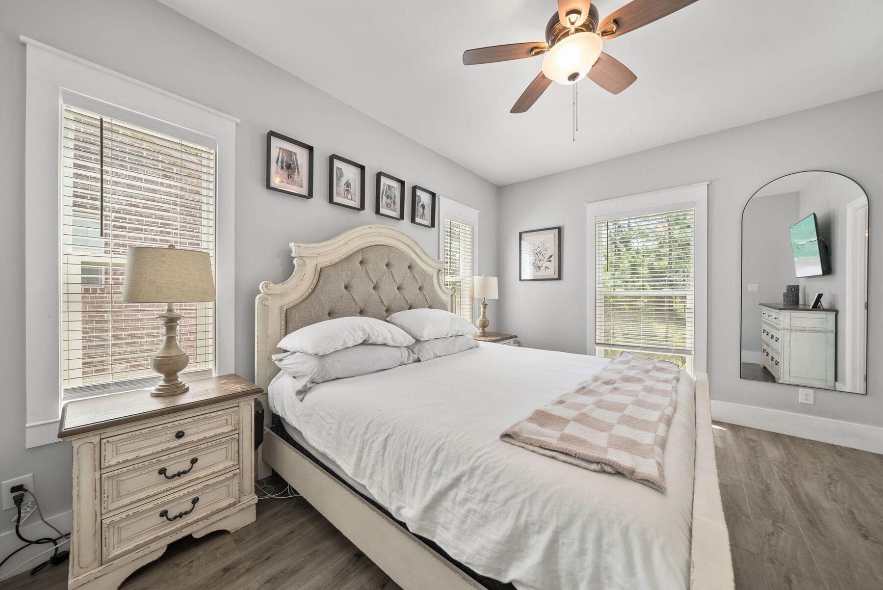 297 Cox Road Santa Rosa Beach, FL 32459 - Photo 19 of 41 a bedroom with a large bed and a window