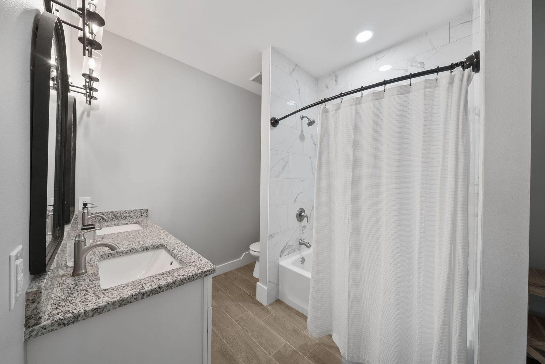 297 Cox Road Santa Rosa Beach, FL 32459 - Photo 27 of 41 a bathroom with a granite countertop sink and a mirror