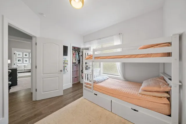 a en suite bathroom with a double vanity sink and a large mirror