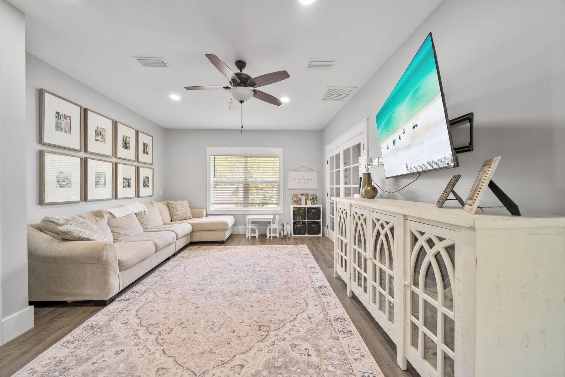 297 Cox Road Santa Rosa Beach, FL 32459 - Photo 30 of 41 a living room with furniture and a large window