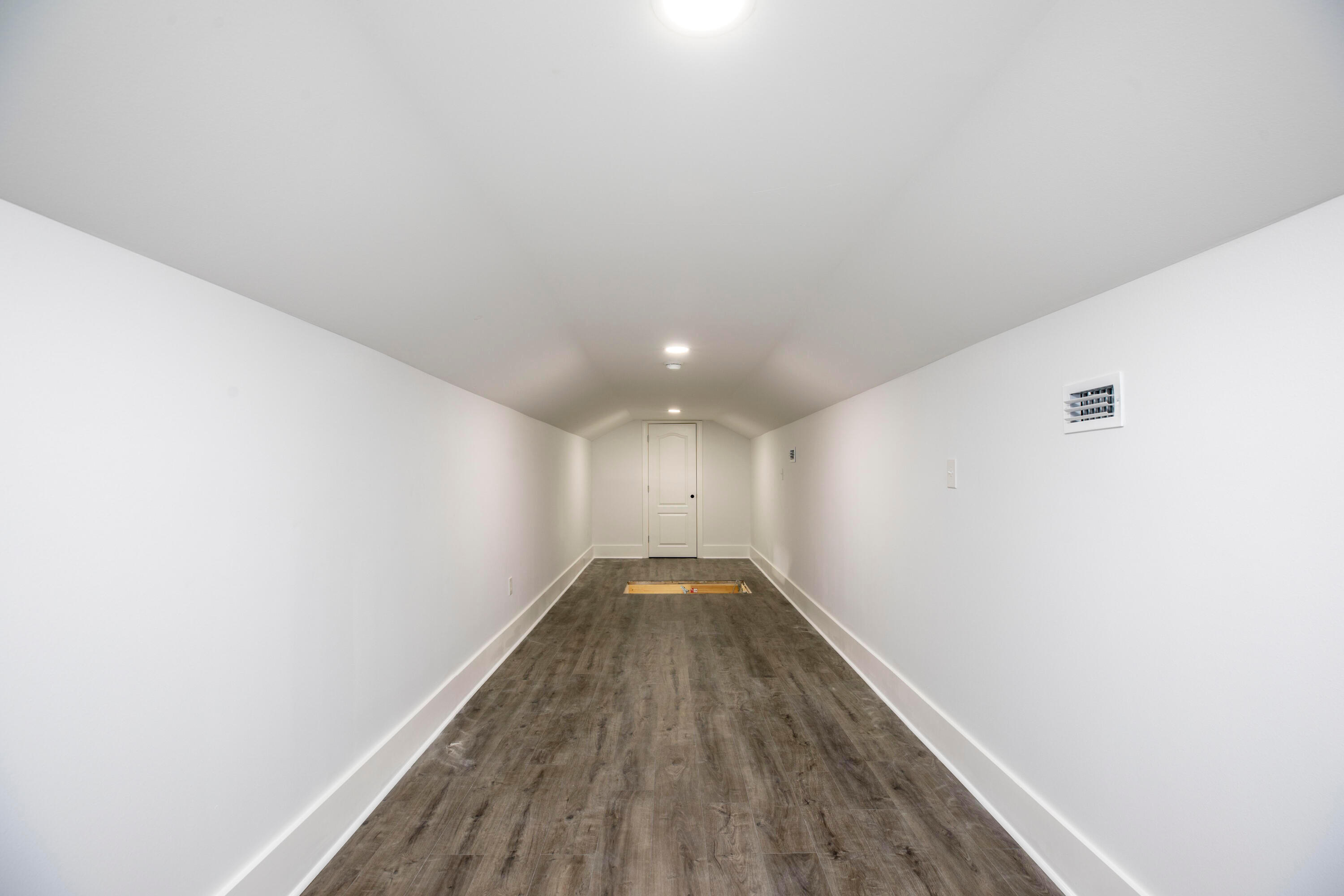 297 Cox Road Santa Rosa Beach, FL 32459 - Photo 34 of 41 a view of a hallway with wooden floor
